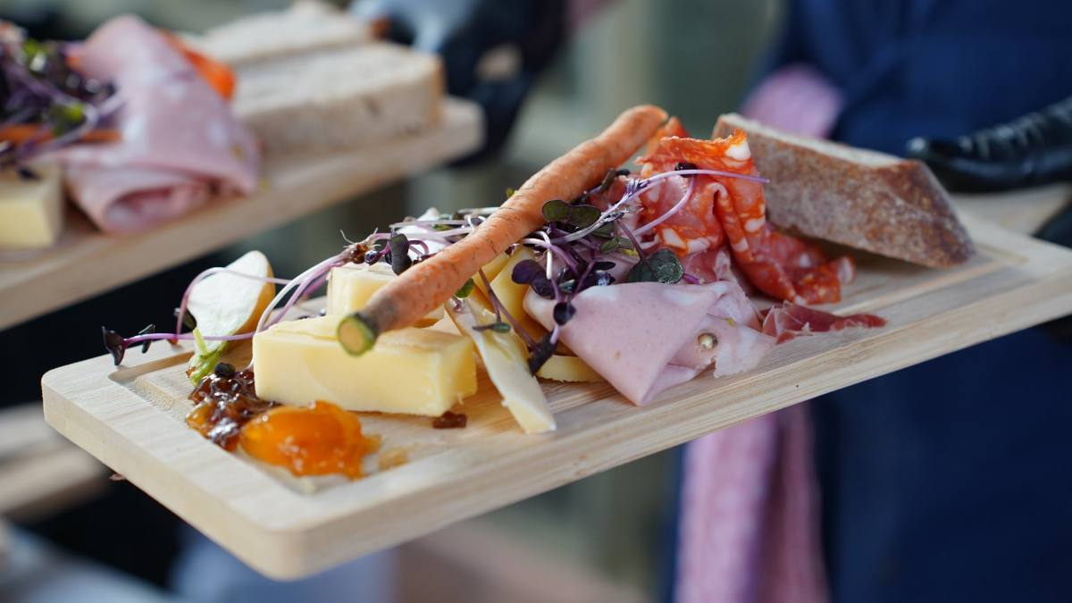 Apéro board with cold cuts, mountain cheese, homemade confit, sourdough and microgreens, Zürich catering